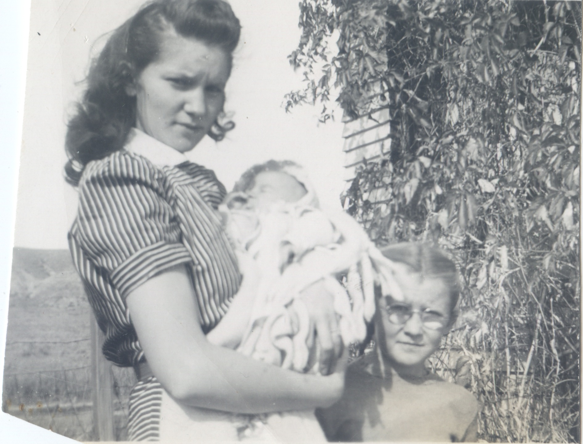 Patsy holding Elinda (w someone named Jean)